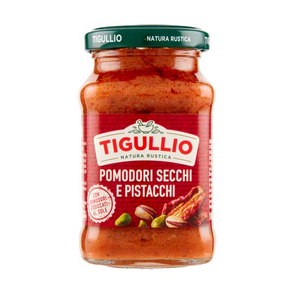 Een elegant 190g glazen potje Tigullio Pesto Gedroogde Tomaten en Pistachenoten, de smaak van de Middellandse Zee.